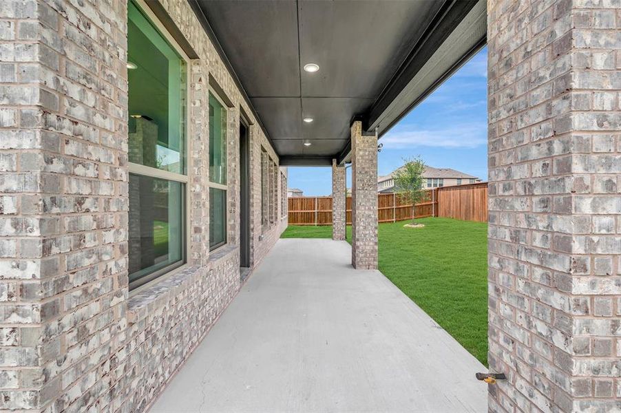 Exterior details and patio area of a home in Lily Creek at Sutton Fields, Aubrey (Image 2). Exterior details and patio area of a home in Lily Creek at Sutton Fields, Aubrey (Image 2).