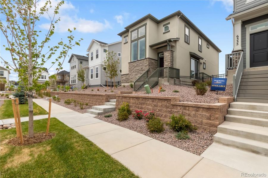 Front exterior of a new home in , Colorado Springs, CO, highlighting curb appeal (Image 23).