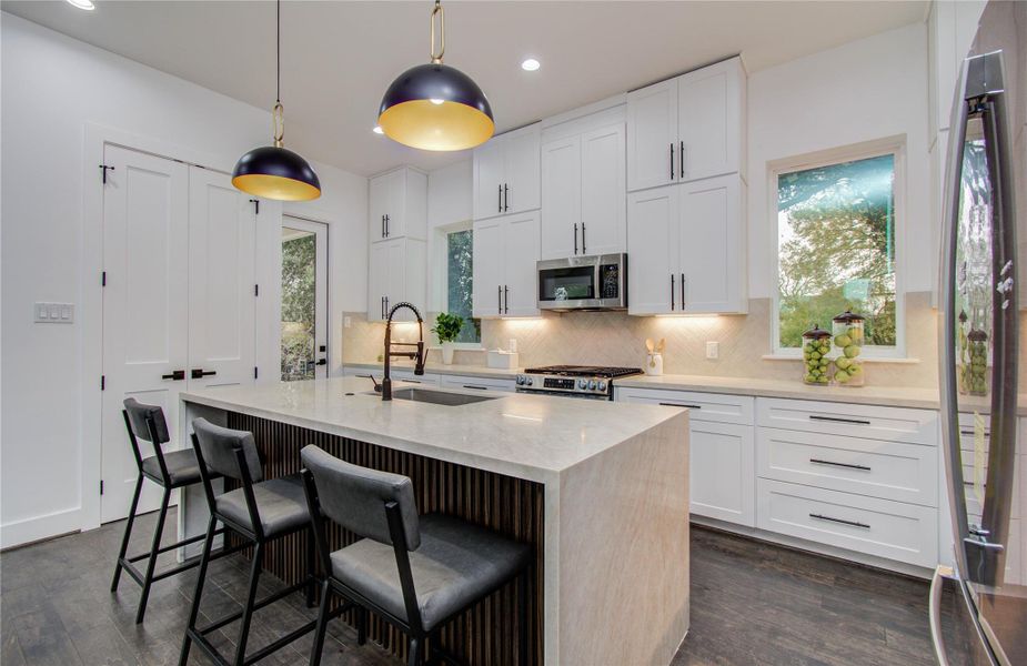 Taj Mahal quartz waterfall countertops for the island