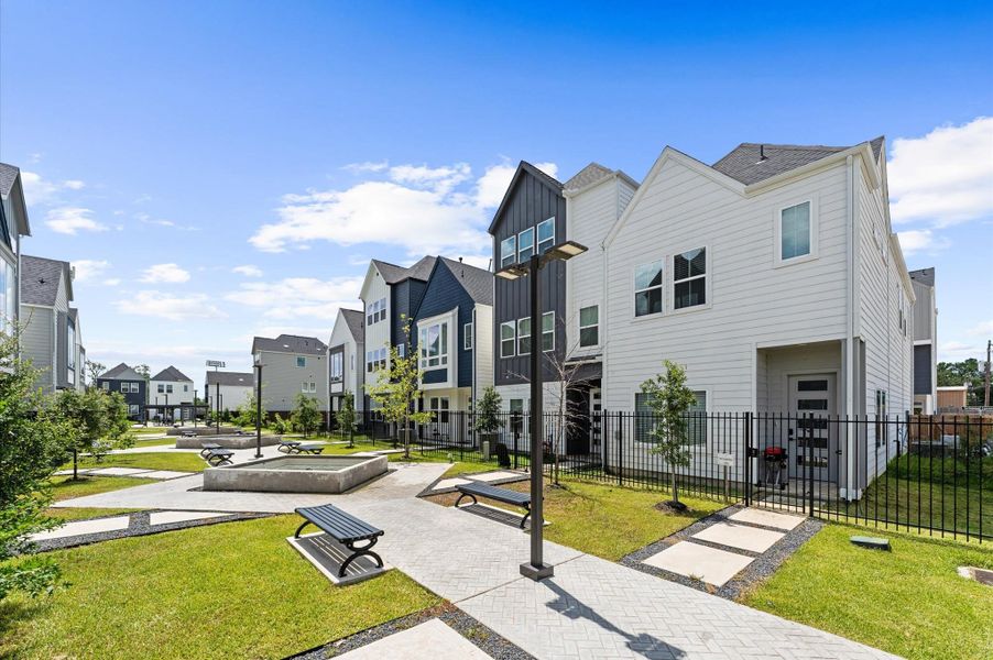 This beautifully landscaped courtyard is the centerpiece of the neighborhood, where graceful pergolas provide shaded retreats and elegant water fountains add a soothing ambiance.