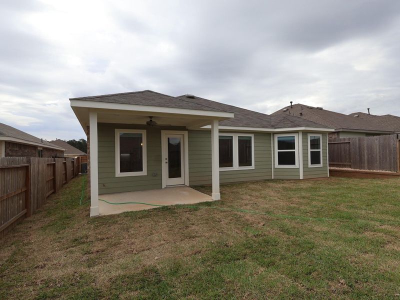Exterior details and patio area of a home in Magnolia Ridge, Magnolia (Image 4).