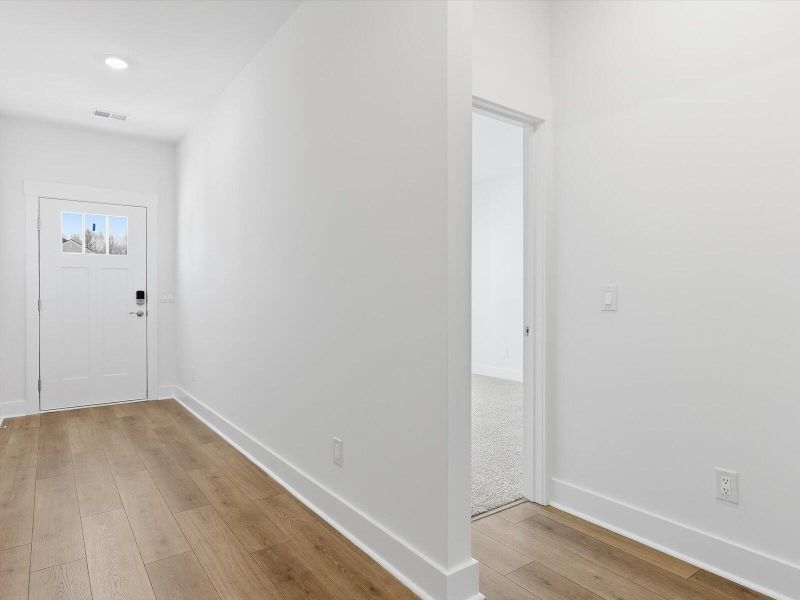 Spacious, unfurnished interior of a new home in The Coves at Lakes of Cane Bay, Summerville (Image 22).