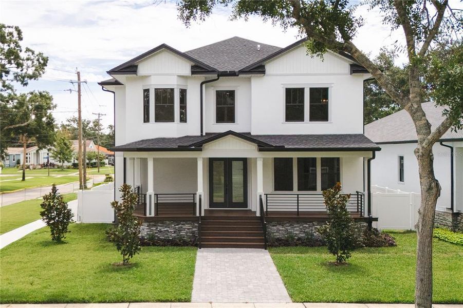 Front exterior of a new home in , Oldsmar, FL, highlighting curb appeal (Image 1). Front exterior of a new home in , Oldsmar, FL, highlighting curb appeal (Image 1).