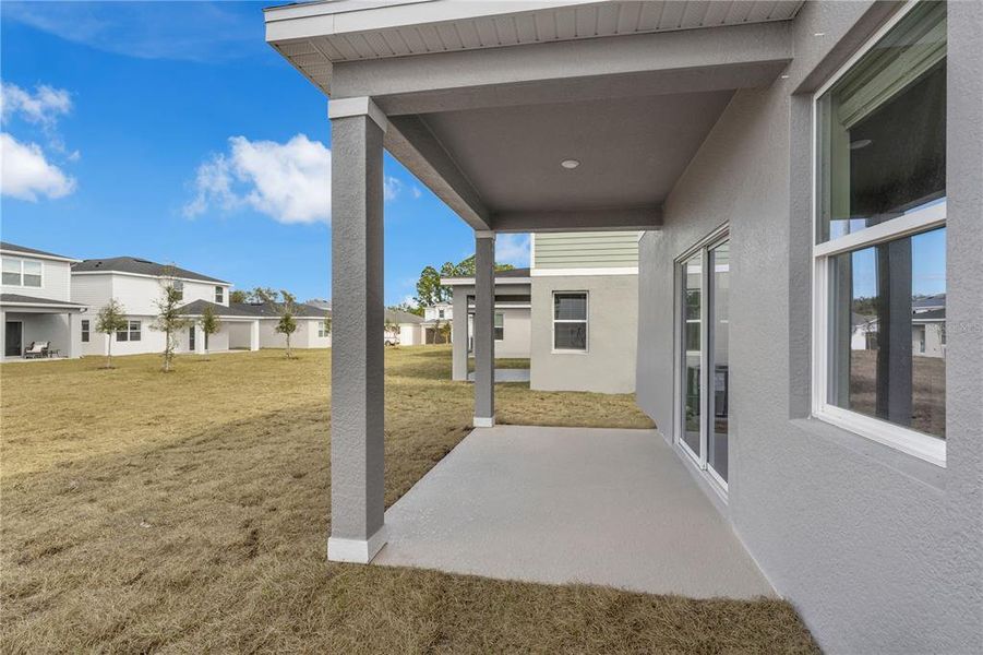 Exterior details and patio area of a home in Oakfield Trails, Parrish (Image 22).