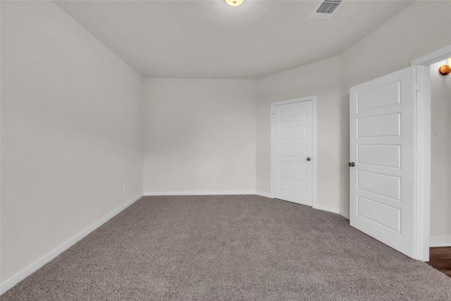 Unfurnished bedroom featuring carpet flooring and baseboards Unfurnished bedroom featuring carpet flooring and baseboards
