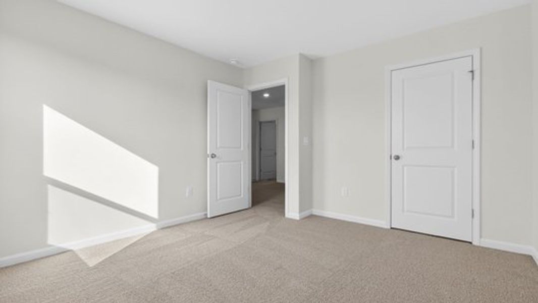 Spacious, unfurnished interior of a new home in The Reserve at Prestleigh, Wake Forest (Image 26).