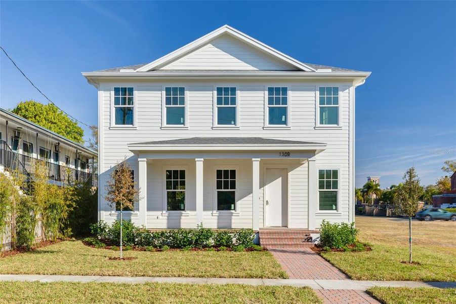 Front exterior of a new home in , St. Petersburg, FL, highlighting curb appeal (Image 6). Front exterior of a new home in , St. Petersburg, FL, highlighting curb appeal (Image 6).