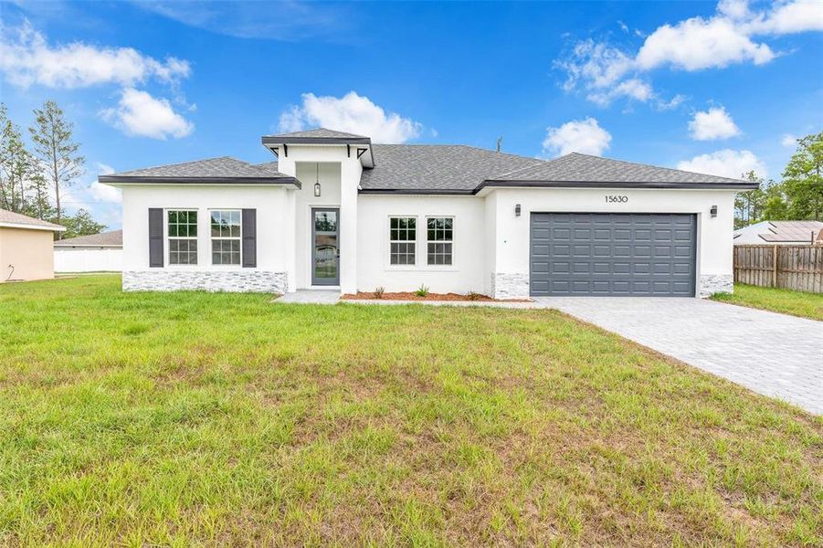 Front exterior of a new home in , Ocala, FL, highlighting curb appeal (Image 20). Front exterior of a new home in , Ocala, FL, highlighting curb appeal (Image 20).