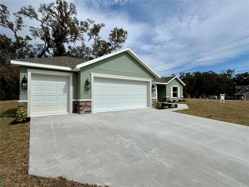 Front exterior of a new home in , Dunnellon, FL, highlighting curb appeal (Image 2). Front exterior of a new home in , Dunnellon, FL, highlighting curb appeal (Image 2).