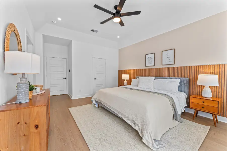 Luxurious second-floor primary bedroom designed to impress with soaring high ceilings, engineered hardwood flooring, and sleek contemporary finishes throughout. The space features two spacious closets for ample storage and organization, while large windows and French doors open to a private balcony—perfect for enjoying morning coffee or evening breezes. Whether styled for relaxation or sophistication, this bedroom is a true sanctuary. Luxurious second-floor primary bedroom designed to impress with soaring high ceilings, engineered hardwood flooring, and sleek contemporary finishes throughout. The space features two spacious closets for ample storage and organization, while large windows and French doors open to a private balcony—perfect for enjoying morning coffee or evening breezes. Whether styled for relaxation or sophistication, this bedroom is a true sanctuary.