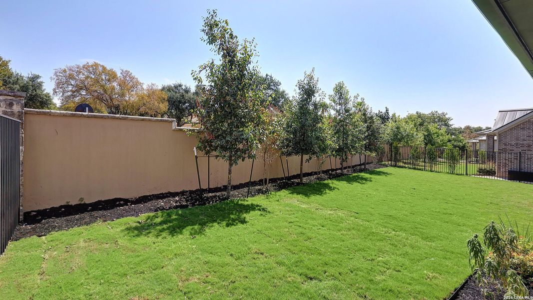 Exterior details and patio area of a home in The Dominion, San Antonio (Image 26).