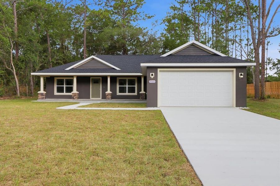 Front exterior of a new home in , Citrus Springs, FL, highlighting curb appeal (Image 1). Front exterior of a new home in , Citrus Springs, FL, highlighting curb appeal (Image 1).