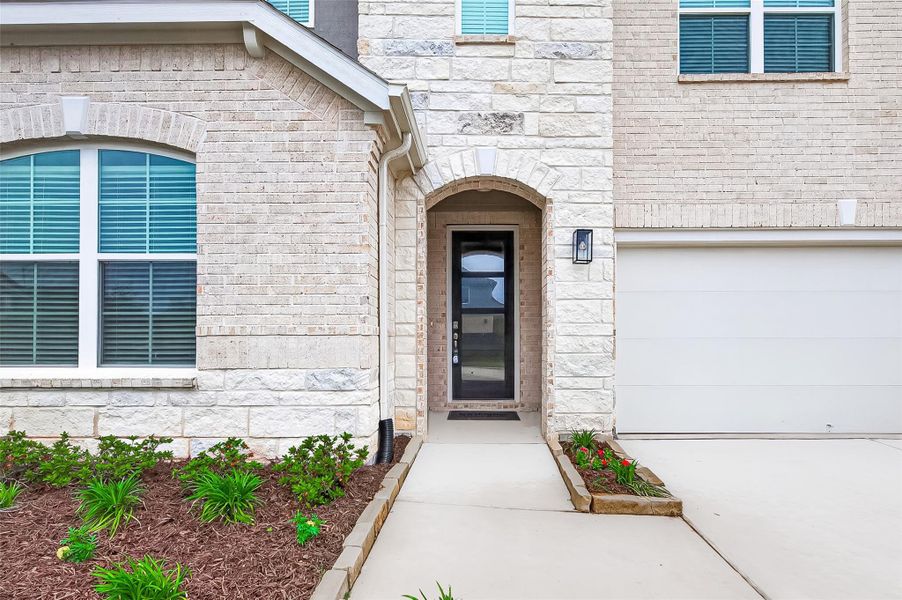 Welcome Home! Stunning entrance with a modern 8ft wood door with elegant glass panels.
