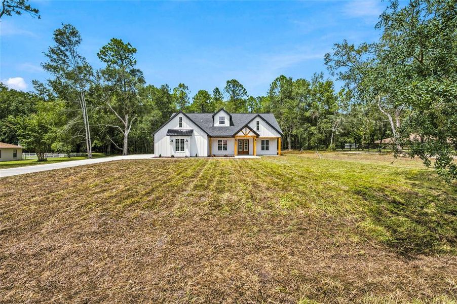 Front exterior of a new home in , Ocala, FL, highlighting curb appeal (Image 2). Front exterior of a new home in , Ocala, FL, highlighting curb appeal (Image 2).