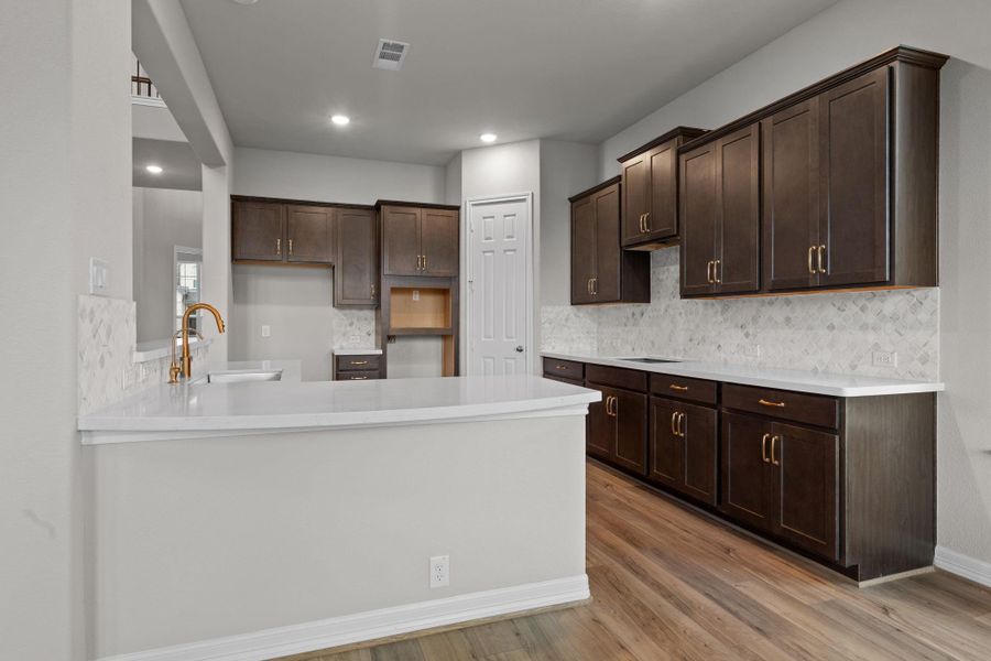 This kitchen is not only a functional space but also has ample storage. Whether you're a seasoned chef or just love to gather and enjoy good food, this kitchen is a dream come true.