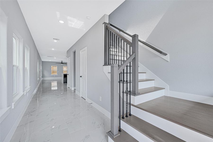 custom oak handrail with metal ballast, and oaks steps