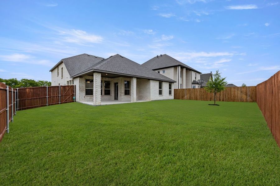 Representative exterior photo of a completed home built from the Winchester by Impression Homes in Timberbrook, Justin, TX (Image 24).