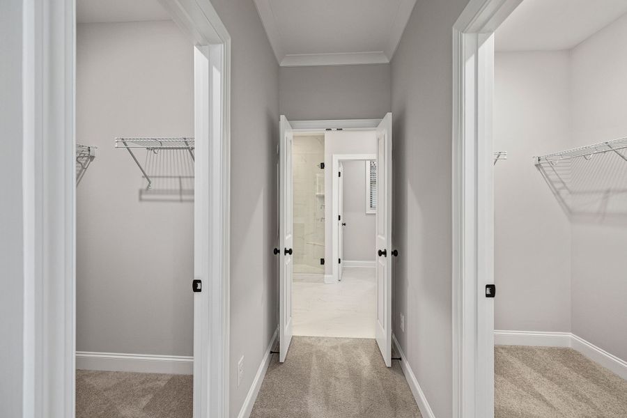 Two walk in closets within the primary bedroom