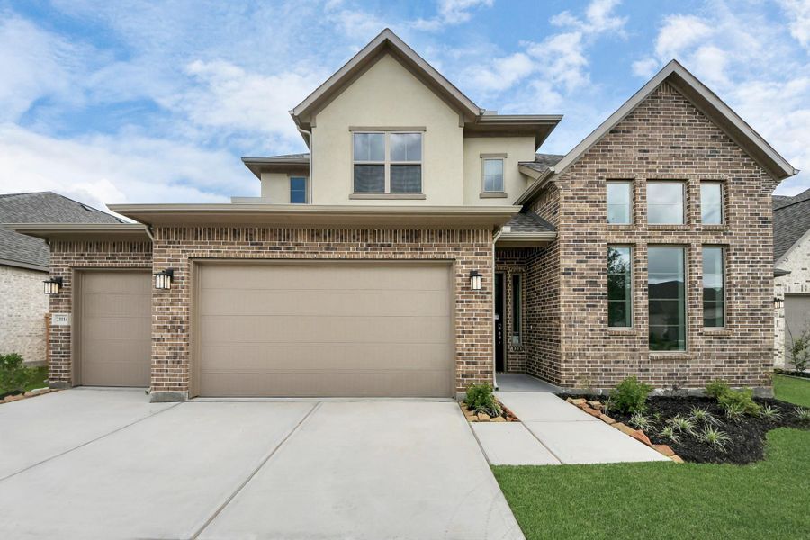 Front exterior of a new home in Marvida, Cypress, TX, highlighting curb appeal (Image 14). Front exterior of a new home in Marvida, Cypress, TX, highlighting curb appeal (Image 14).