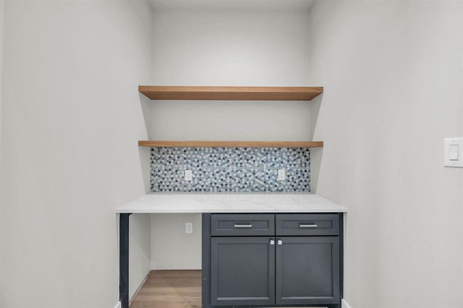 Gameroom with coffered ceiling and access to the covered patio