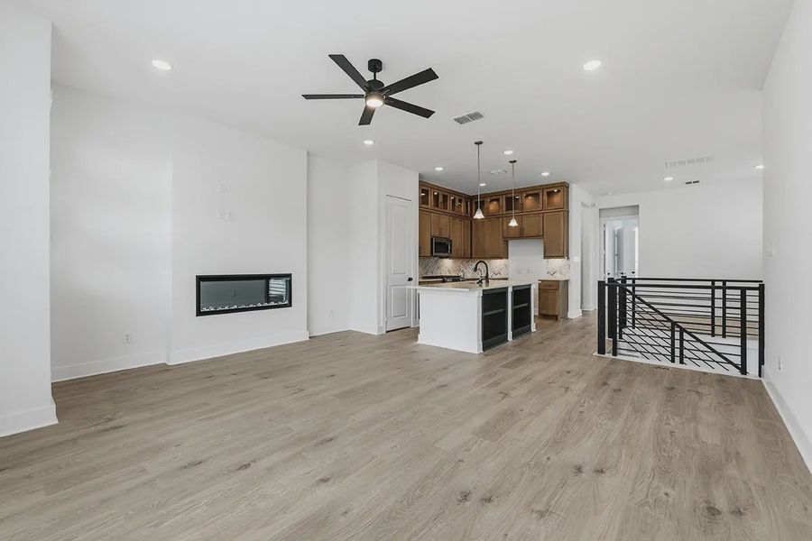 Spacious, unfurnished interior of a new home in Centero at Stone Oak, San Antonio (Image 12).