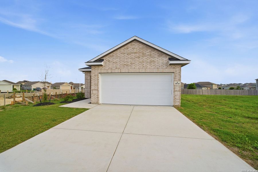 Front exterior of a new home in Willow View, Converse, TX, highlighting curb appeal (Image 1). Front exterior of a new home in Willow View, Converse, TX, highlighting curb appeal (Image 1).