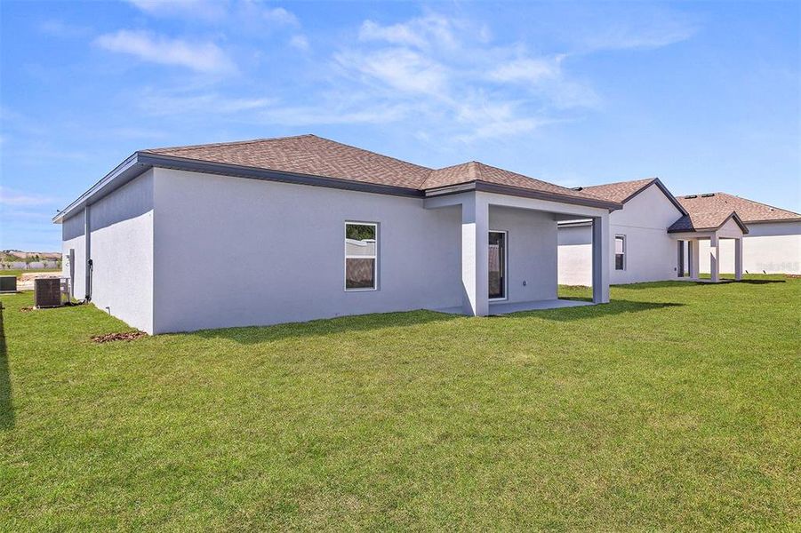 Front exterior of a new home in Peach Crossings, Winter Haven, FL, highlighting curb appeal (Image 2). Front exterior of a new home in Peach Crossings, Winter Haven, FL, highlighting curb appeal (Image 2).