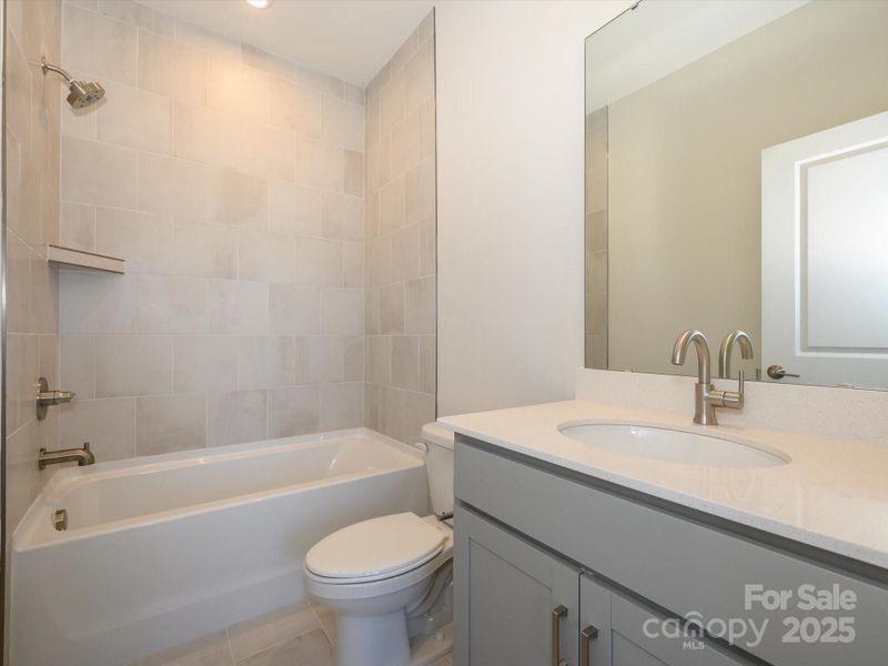 Tile surround secondary shower for a timeless look.