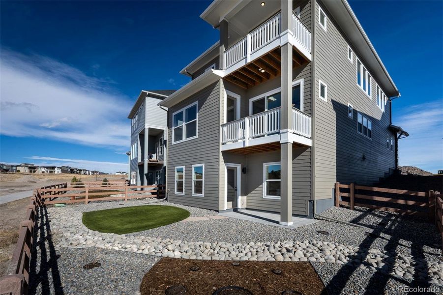 Exterior details and patio area of a home in Revel Crossing at Wolf Ranch - The Panorama Collection, Colorado Springs (Image 24).