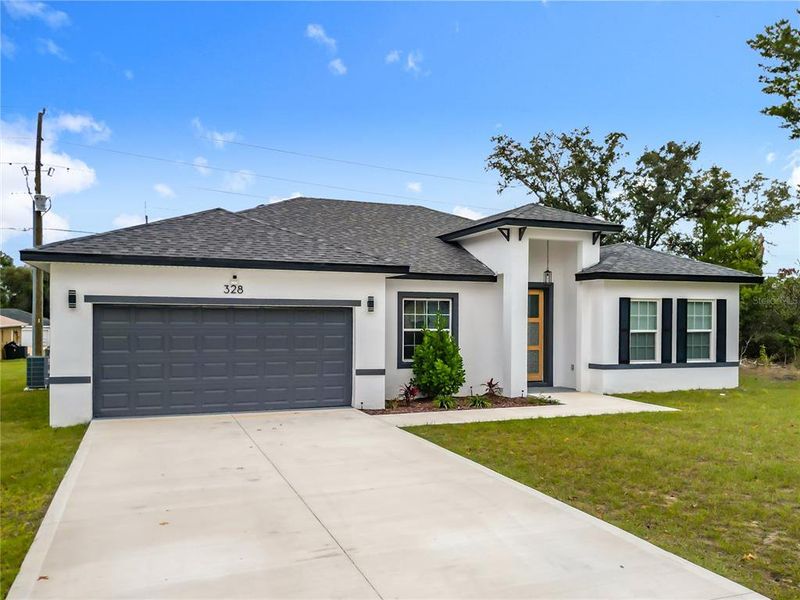 Front exterior of a new home in , Ocala, FL, highlighting curb appeal (Image 19).