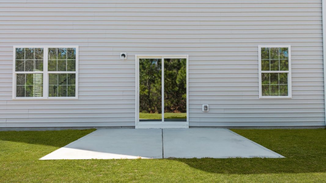 Exterior details and patio area of a home in Ridgewood Farms, Winterville (Image 14).