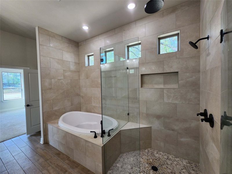 Bathroom with walk in shower, wood finished floors, a garden tub, and recessed lighting