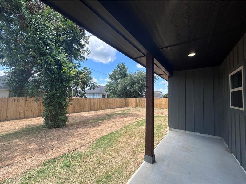 Fenced backyard featuring a patio area Fenced backyard featuring a patio area