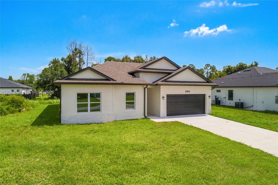 Front exterior of a new home in , North Port, FL, highlighting curb appeal (Image 16). Front exterior of a new home in , North Port, FL, highlighting curb appeal (Image 16).