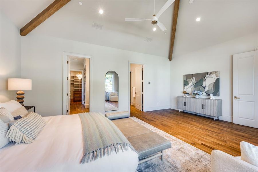 Bedroom with beamed ceiling, recessed lighting, wood finished floors, ceiling fan, and high vaulted ceiling Bedroom with beamed ceiling, recessed lighting, wood finished floors, ceiling fan, and high vaulted ceiling