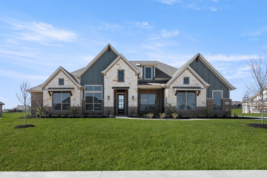 Front exterior of a new home in Paloma Ranch, Justin, TX, highlighting curb appeal (Image 17).
