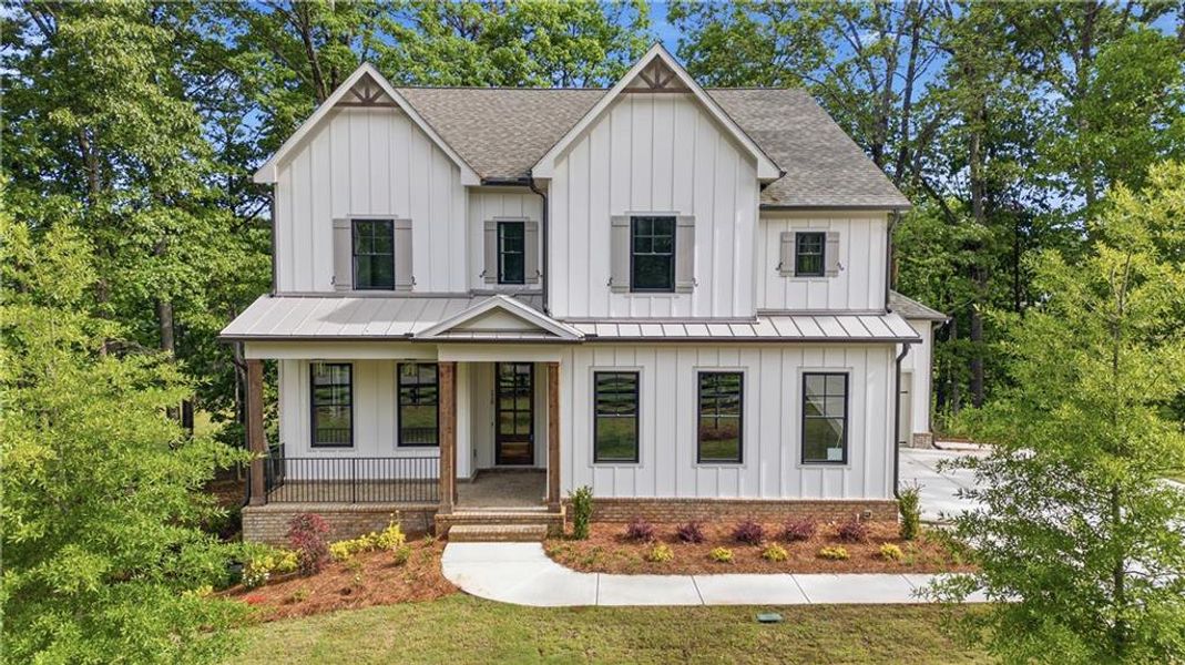 Front exterior of a new home in , Canton, GA, highlighting curb appeal (Image 25).
