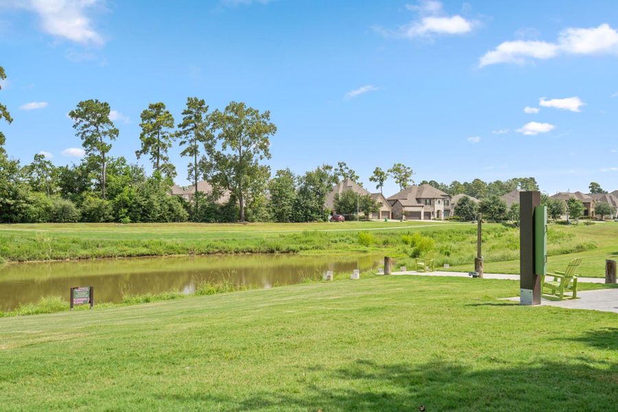 Community pond, walking area and green space showcasing the outdoor lifestyle available in The Groves.