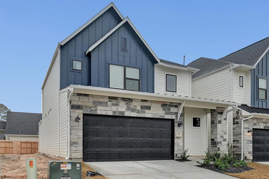 Front exterior of a new home in Summer Place  35', Montgomery, TX, highlighting curb appeal (Image 26).