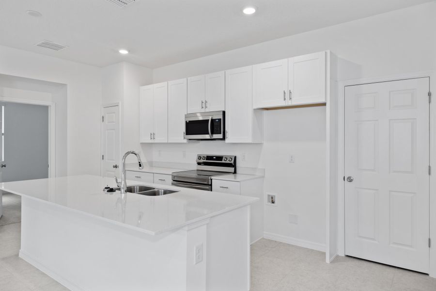 Furnished interior view inside a new home in Mirror Lake Village, Fruitland Park (Image 6).