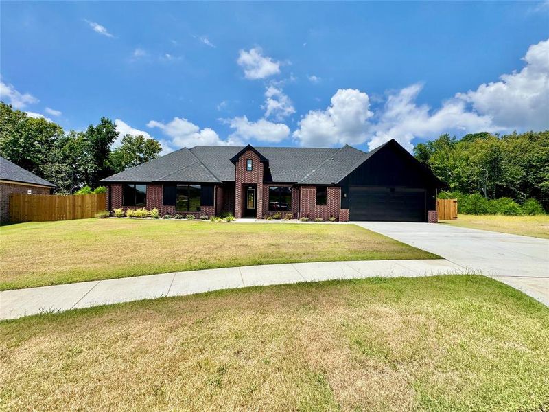 Front exterior of a new home in , Lindale, TX, highlighting curb appeal (Image 2). Front exterior of a new home in , Lindale, TX, highlighting curb appeal (Image 2).