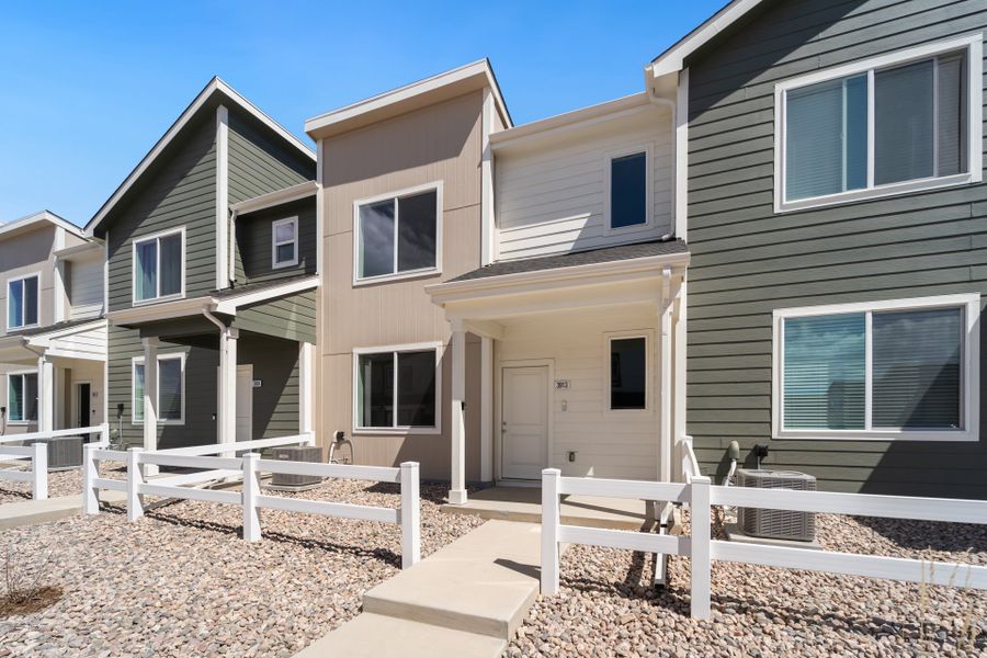 Front exterior of a new home in Liberty Draw, Evans, CO, highlighting curb appeal (Image 16).
