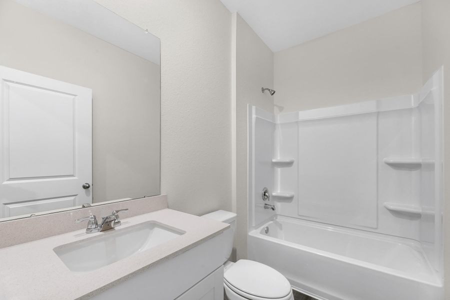 Furnished interior view inside a new home in Royal Pines, Porter (Image 7).