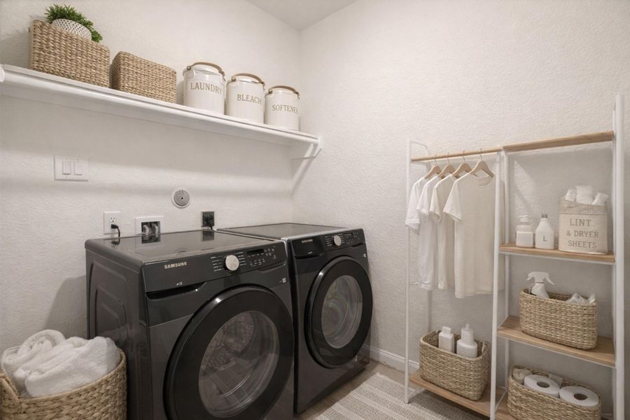 Bright laundry room features a clean white shelf, dedicated hookups, and convenient in-home utility space.