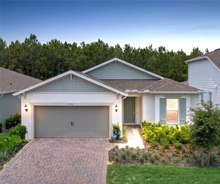 Front exterior of a new home in , Minneola, FL, highlighting curb appeal (Image 27). Front exterior of a new home in , Minneola, FL, highlighting curb appeal (Image 27).