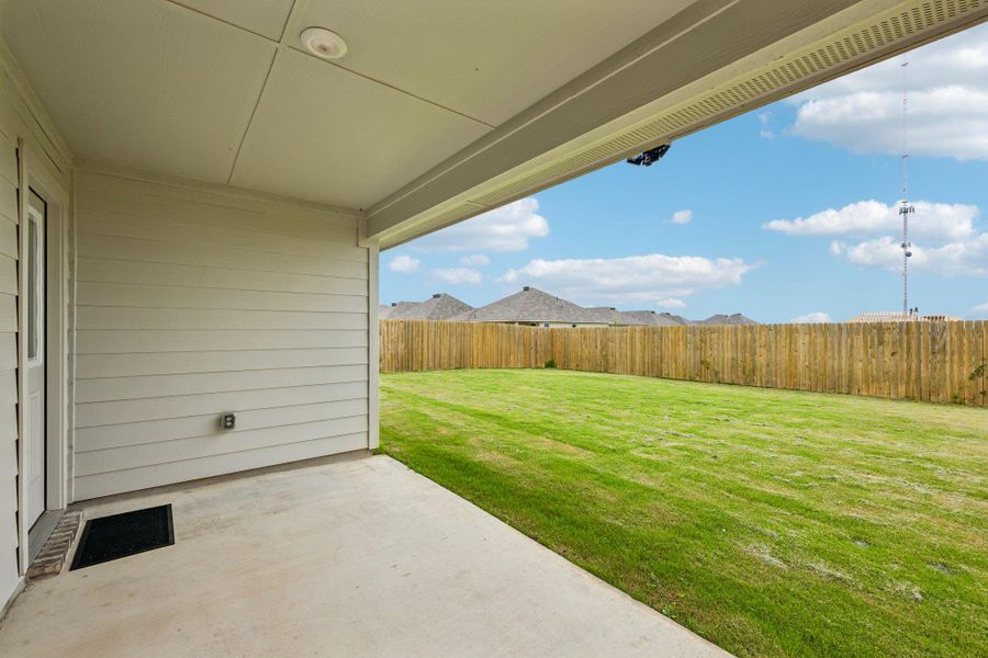 Covered concrete patio with recessed lighting