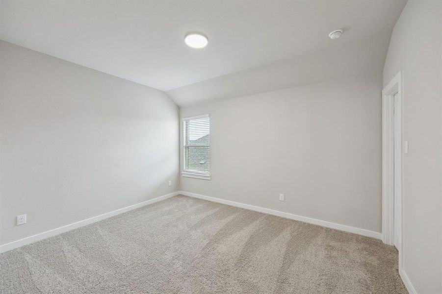 Bedroom in the Stanley II home plan by Trophy Signature Homes – REPRESENTATIVE PHOTO