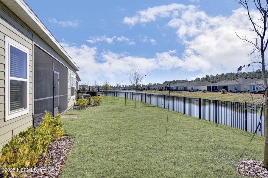 Exterior details and patio area of a home in Tributary: Lakeview at Tributary 60's, Yulee (Image 24).