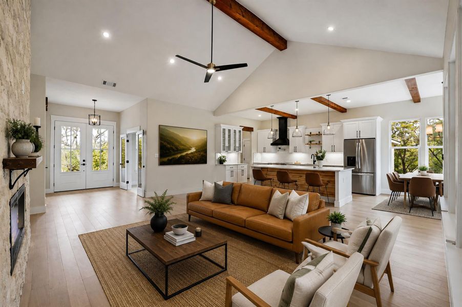 A stone fireplace anchors the soaring living space with wood beams and smooth hardwood floors.Virtual Staging. A stone fireplace anchors the soaring living space with wood beams and smooth hardwood floors.Virtual Staging.