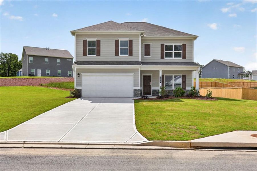 Front exterior of a new home in Jones Ridge, Dallas, GA, highlighting curb appeal (Image 28). Front exterior of a new home in Jones Ridge, Dallas, GA, highlighting curb appeal (Image 28).